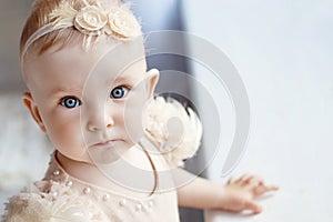 Portrait of the lovely little girl with blue eyes. Serious quiet look. Copy space