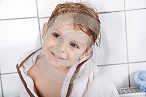 Portrait of lovely little toddler boy of two years with bath to