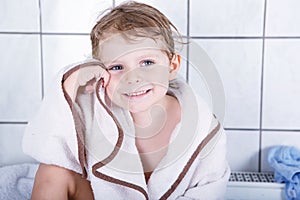 Portrait of lovely little toddler boy of two years with bath to