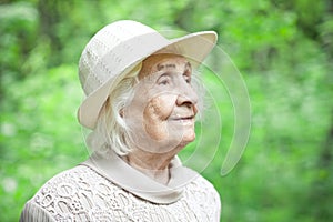 Portrait of a lovely old woman smiling outdoors