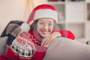 Portrait of lovely sweet girl toothy smile sitting comfy sofa spent magic festive time house indoors