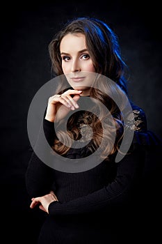 Portrait of a lovely young woman in a studio