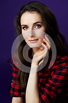 Portrait of a lovely young woman in a studio