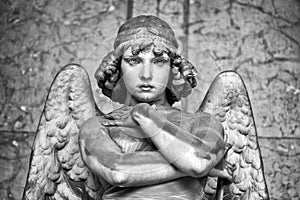 Portrait of loving angel on marble, monumental cemetery of Genoa, Italy, one of the most important monumental cemeteries in Europe photo