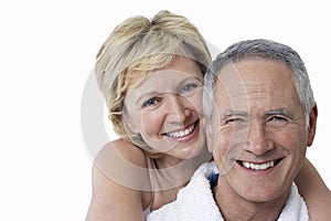 Portrait of loving couple smiling over white background