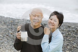Portrait Of A Loving Happy Couple On Beach