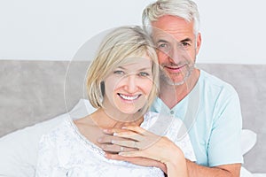 Portrait of a loving mature couple in bed