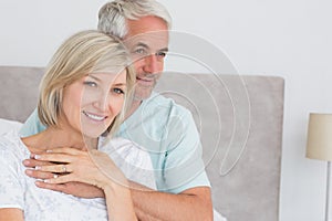 Portrait of a loving mature couple in bed