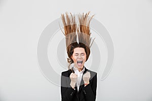 Portrait of a mad businesswoman dressed in suit