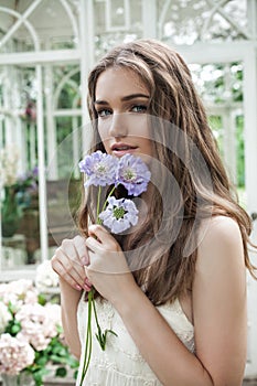 Portrait of Magnificent Woman with Blue Flowers