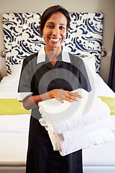 Portrait Of Maid Tidying Hotel Room