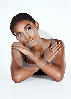 Portrait, makeup and beauty of woman in studio for healthy glow  on white background in spa. Face, cosmetics and