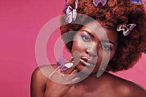 Portrait, makeup and black woman with butterflies in studio with creative, art and fantasy. Cosmetics, beauty and female