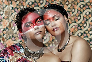 Portrait, makeup and tribal of women for culture, tradition and heritage celebration in studio. Creativity, girls and