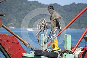 Portrait of a Malaysian male worker on the fishing boat in Kota Kinabalu, Sabah, Malaysia