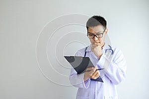 Portrait of Male asian doctor in a uniform working in the office hospital. healtcare and assistance concept