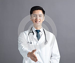 Portrait of male asian young doctor  with handshake gesture
