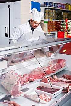 Portrait of male butcher in kosher section at supermarket