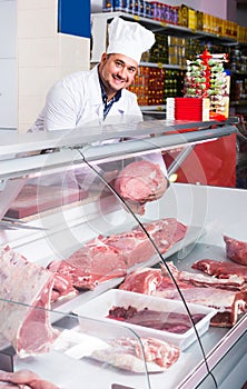 Portrait of male butcher in kosher section at supermarket