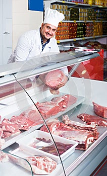 Portrait of male butcher in kosher section at supermarket