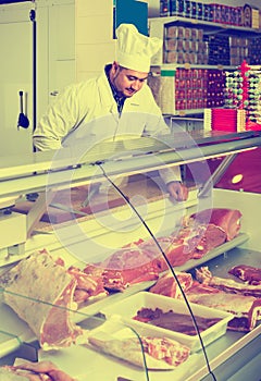 Portrait of male butcher in kosher section at supermarket