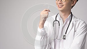 Portrait of male confident doctor over white background studio, healthcare and Medical technology concept