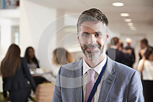 Portrait Of Male Delegate During Break At Conference