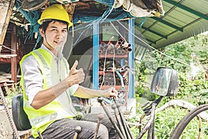 Portrait of a male developer sitting operator driving excavator at construction site