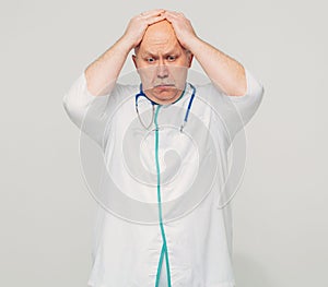 Portrait of male doctor having bad news