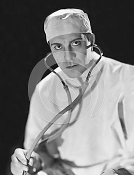 Portrait of a male doctor holding a stethoscope