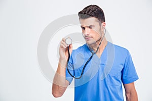 Portrait of a male doctor holding stethoscope