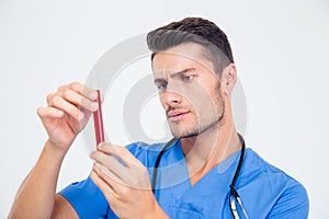 Portrait of a male doctor holding test tube