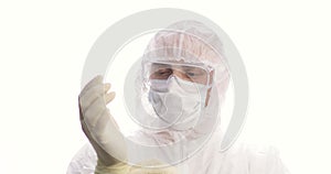 Portrait of a male doctor or medical staff in protective suit, gloves and mask. Infection prevention and control of