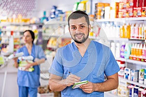 Portrait of male druggist in drugstore