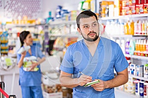 Portrait of male druggist in drugstore