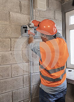 Portrait of male electrician in a factory photo