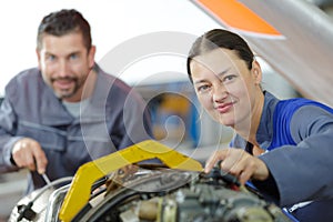 portrait male and female aircraft mechanics at work