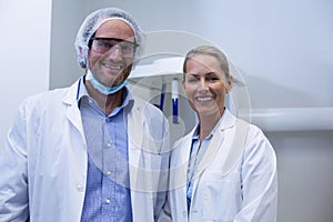 Portrait of male and female dentist smiling