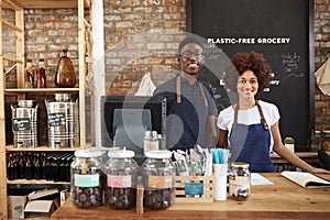 Portrait Of Male And Female Owners Of Sustainable Plastic Free Grocery Store