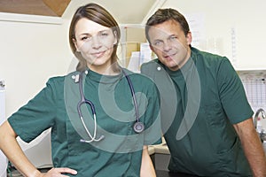 Portrait Of Male And Female Vets In Surgery