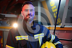 Portrait of male firefighter in uniform at fire station