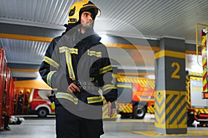 Portrait of male firefighter in uniform at fire station