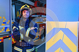 Portrait of male firefighter in uniform at fire station