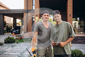 portrait of male gardeners at the facility