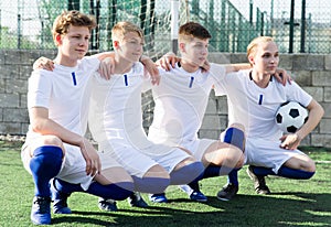 Portrait Of male high school soccer team on field