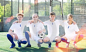 Portrait Of male high school soccer team on field