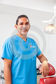 Portrait of a male middle -aged dentist at his office