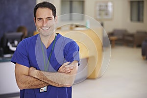 Portrait Of Male Nurse In Hospital Reception