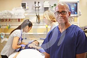 Portrait Of Male Nurse Working In Emergency Room