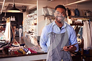 Portrait Of Male Owner Of Gift Store With Digital Tablet